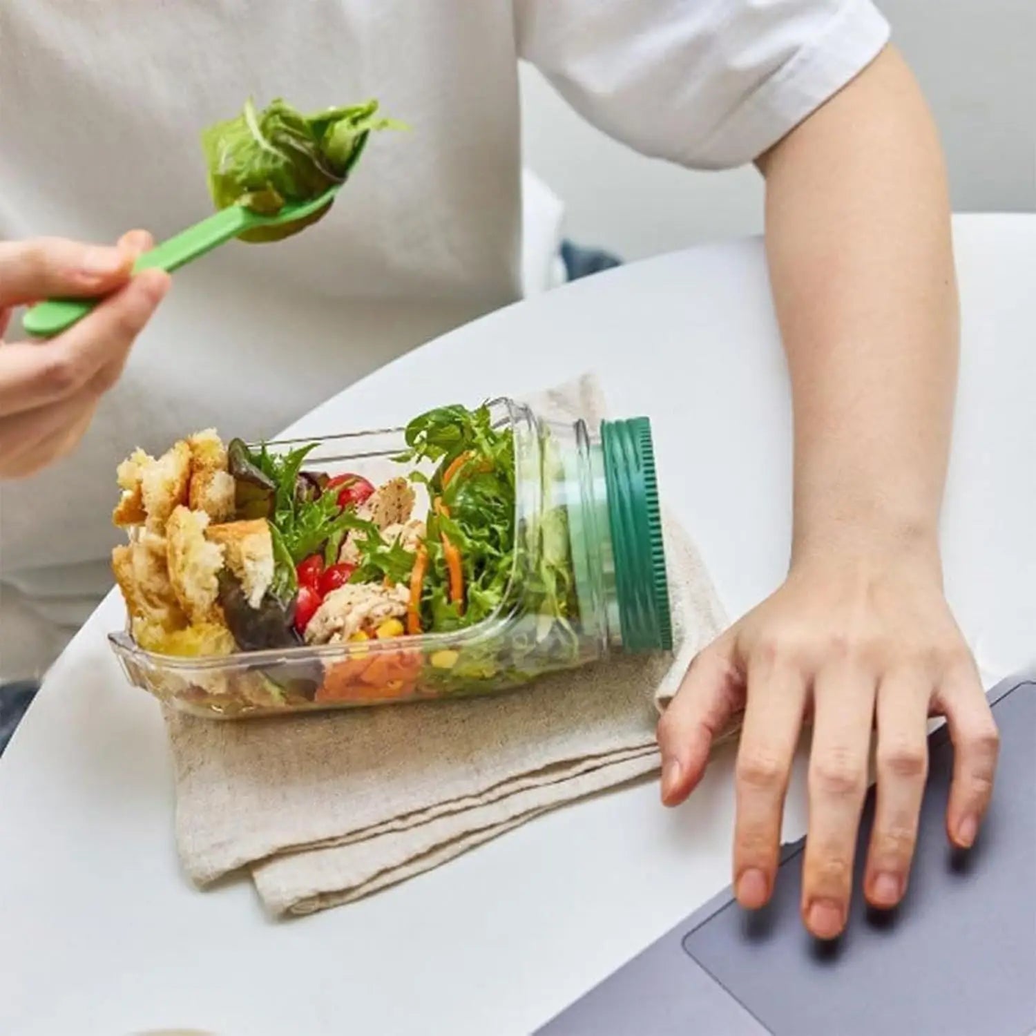Portable salad container with a side-opening lid